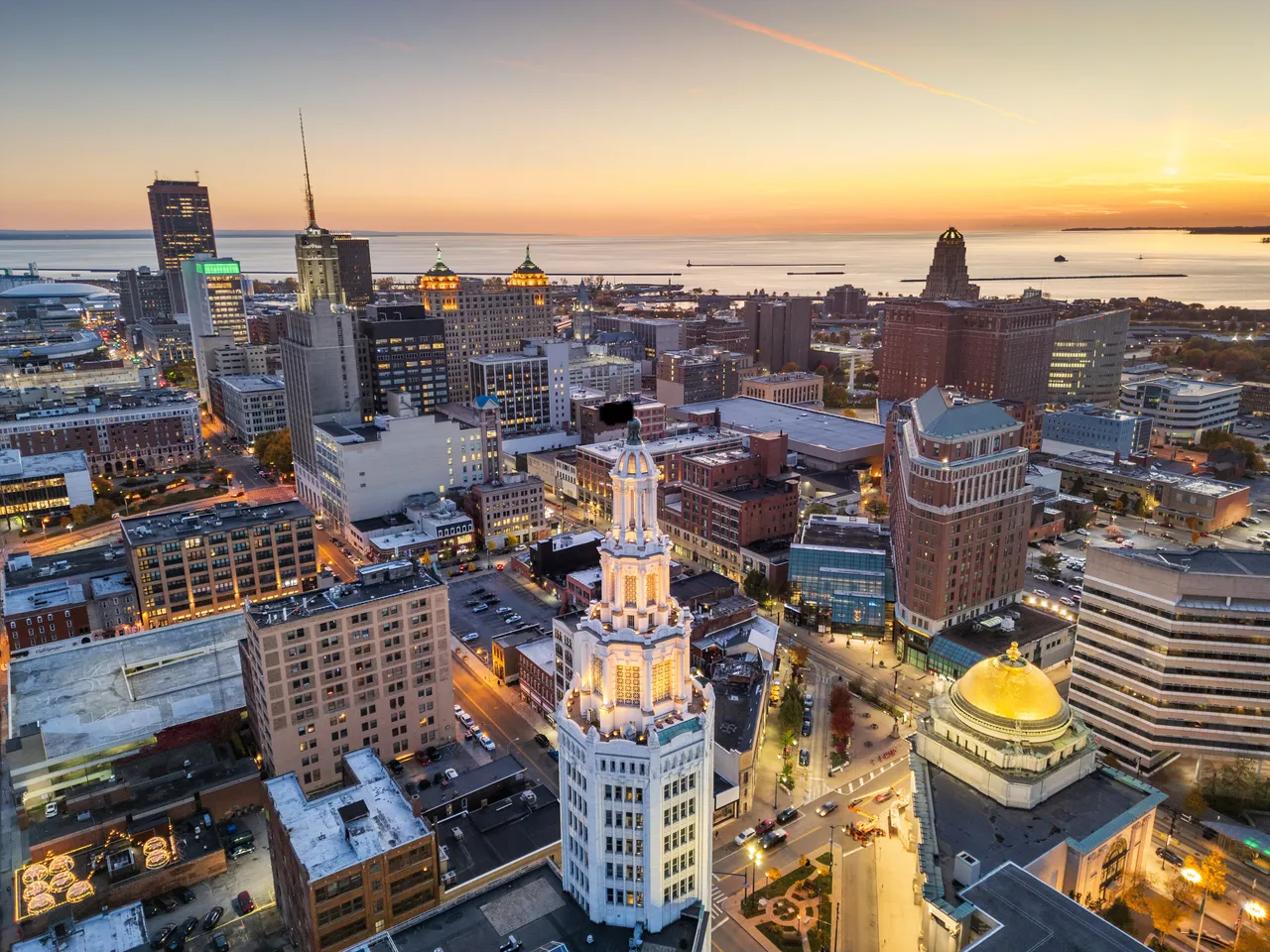Downtown Buffalo at sunset, seen from above, with Lake Erie beyond